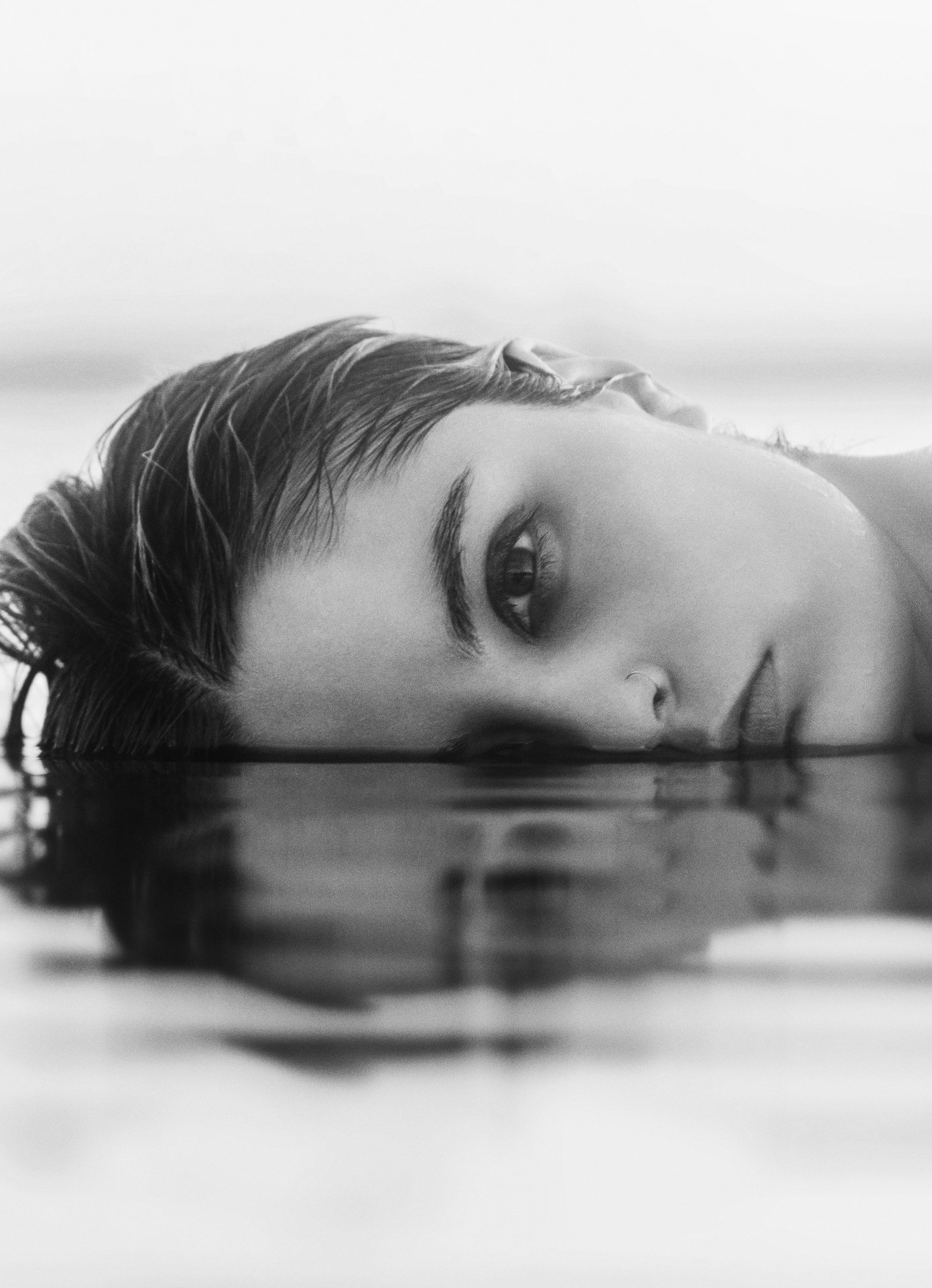 Woman With Half of Face in Water 